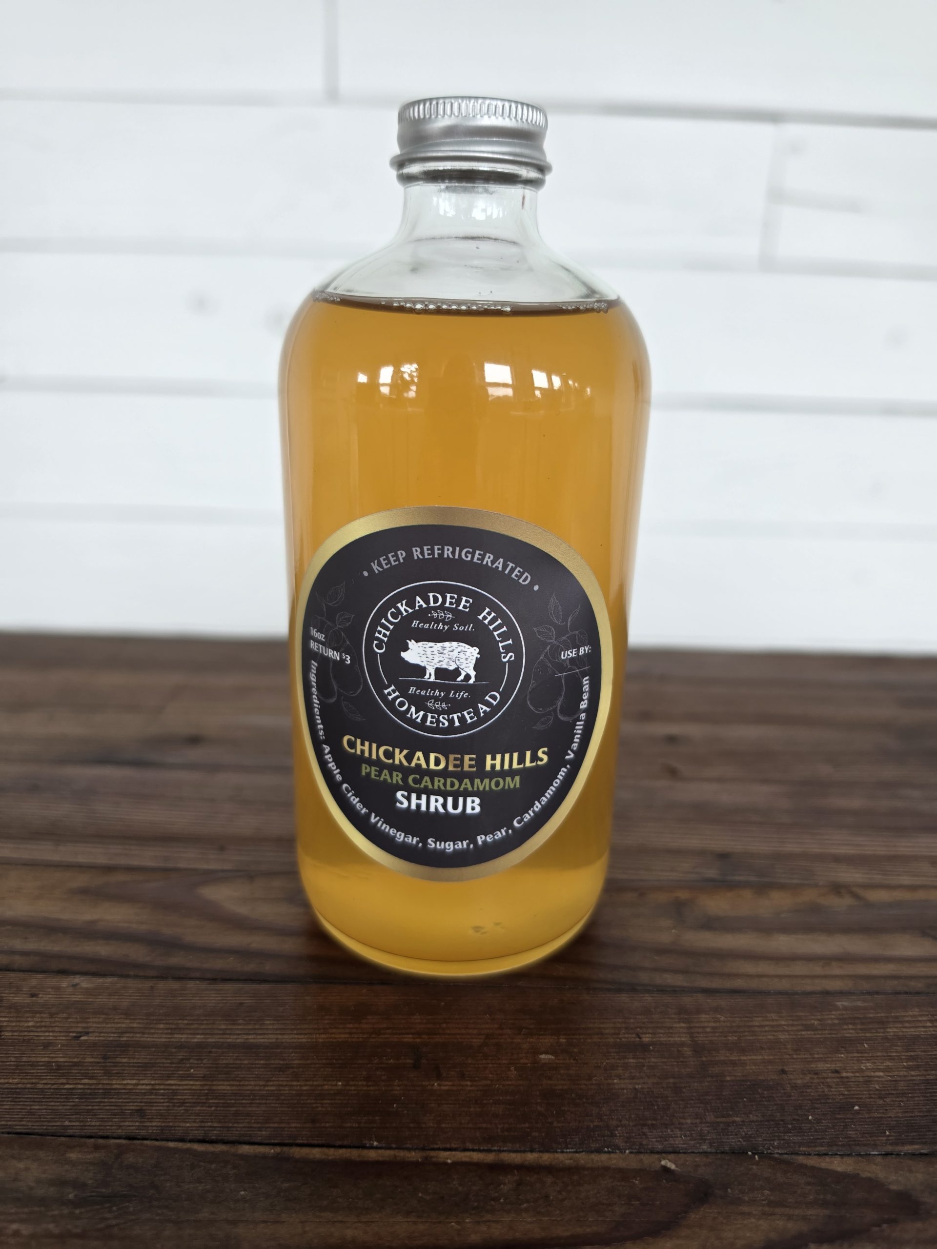 Bottle of Chickadee Hills Pear Cardamom Shrub